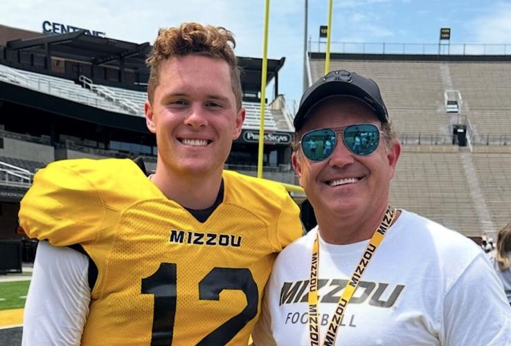 Brady Cook and his dad, Jim Cook